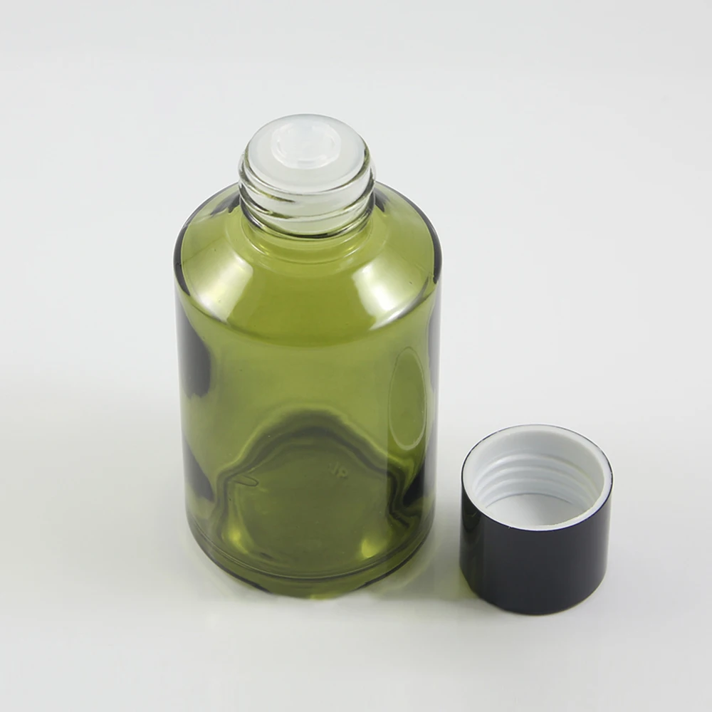 125 мл кръгла светло зелена бутилка за лосион с черна капак на винт и прозрачен редуктор, голяма стъклена е козметична бутилка за течно крем
